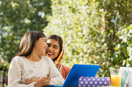 simsearch:649-06304951,k - Happy mother and daughter using laptop on patio Stock Photo - Premium Royalty-Free, Code: 6113-09241039