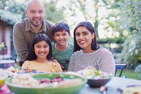 simsearch:614-06623604,k - Portrait happy family eating lunch at table Stock Photo - Premium Royalty-Free, Code: 6113-09241124