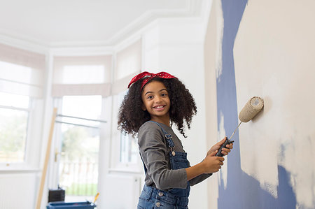 painting (non-artistic activity) - Portrait happy girl painting wall Stock Photo - Premium Royalty-Free, Code: 6113-09241280