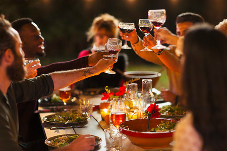 simsearch:6113-08659553,k - Friends toasting wine glasses at dinner garden party Stock Photo - Premium Royalty-Free, Code: 6113-09241340
