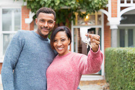 simsearch:632-05845211,k - Portrait happy couple with house keys outside new house Stock Photo - Premium Royalty-Free, Code: 6113-09241309