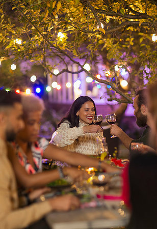 simsearch:6113-08659553,k - Friends toasting wine glasses, enjoying dinner garden party Stock Photo - Premium Royalty-Free, Code: 6113-09241425
