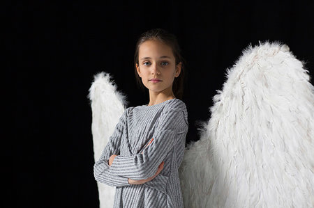 simsearch:400-05744172,k - Portrait confident, brave girl wearing angel wings Stock Photo - Premium Royalty-Free, Code: 6113-09272503