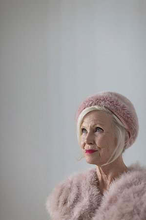 elegant woman looking away - Portrait confident, elegant senior woman wearing pink fur Stock Photo - Premium Royalty-Free, Code: 6113-09200067