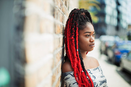 simsearch:693-06435933,k - Confident young woman with red braids looking away on urban street Stock Photo - Premium Royalty-Free, Code: 6113-09220585