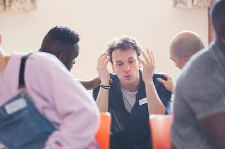 simsearch:649-06717849,k - Men comforting man talking in group therapy Stock Photo - Premium Royalty-Free, Code: 6113-09220743
