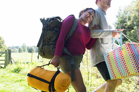 simsearch:6113-07242393,k - Affectionate couple carrying camping equipment Stock Photo - Premium Royalty-Free, Code: 6113-09239865