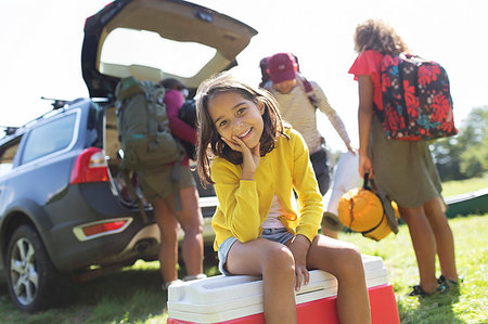 simsearch:6113-07159174,k - Portrait smiling girl camping with family, unloading car Stock Photo - Premium Royalty-Free, Code: 6113-09239899