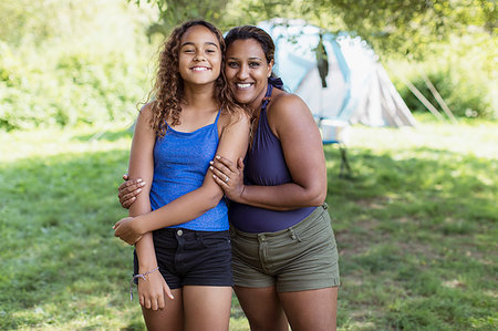 simsearch:6108-06167233,k - Portrait happy, affectionate mother and daughter at campsite Photographie de stock - Premium Libres de Droits, Code: 6113-09239931