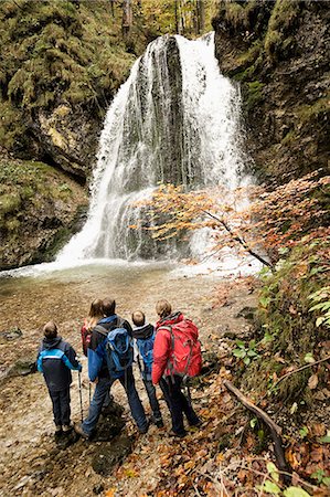 Family In Front Of A Waterfall, Bavaria, Germany, Europe Stock Photo - Premium Royalty-Free, Code: 6115-06778794