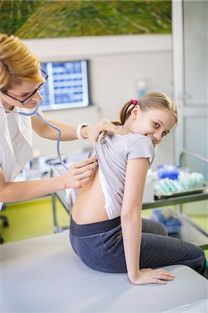 female doctor with child - Female doctor using stethoscope on girl, Osijek, Croatia Stock Photo - Premium Royalty-Free, Code: 6115-06778956