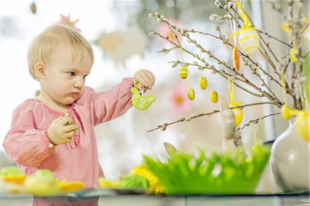 Young Girl Hanging Easter Decorations, Osijek, Croatia, Europe Stock Photo - Premium Royalty-Free, Code: 6115-06778994