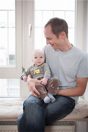 simsearch:6115-07539732,k - Young father with baby boy, Munich, Bavaria, Germany Stock Photo - Premium Royalty-Free, Code: 6115-06779097