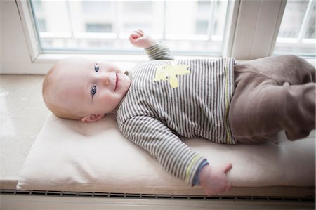 simsearch:6115-06778553,k - Baby boy lying on back, Munich, Bavaria, Germany Stock Photo - Premium Royalty-Free, Code: 6115-06779094