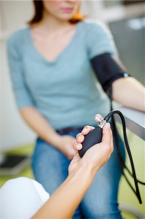 doctor patient consultation not eye contact - Blood Pressure Testing Stock Photo - Premium Royalty-Free, Code: 6115-06733311