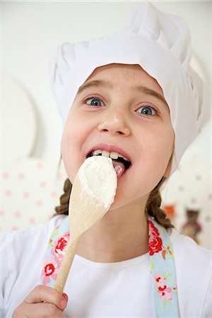 simsearch:649-05520883,k - Little girl with chef's hat tasting dough, Munich, Bavaria, Germany Stock Photo - Premium Royalty-Free, Code: 6115-06966921