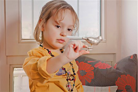 simsearch:6115-06778498,k - Little girl playing with Christmas decoration, Munich, Bavaria, Germany Stock Photo - Premium Royalty-Free, Code: 6115-06967048