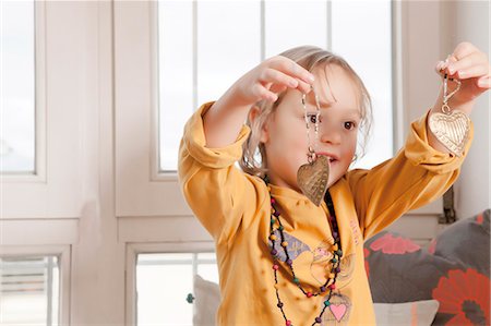 simsearch:6115-06778498,k - Little girl playing with Christmas decoration, Munich, Bavaria, Germany Stock Photo - Premium Royalty-Free, Code: 6115-06967049