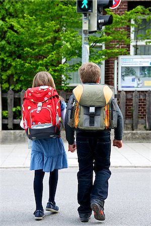 school girl back - Two children walking to school, rear view, Munich, Bavaria, Germany Stock Photo - Premium Royalty-Free, Code: 6115-07109660