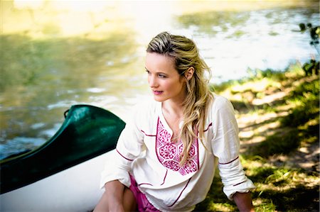 relaxed woman natural - Young woman sits on the riverside, foothills of the Alps, Bavaria, Germany Stock Photo - Premium Royalty-Free, Code: 6115-07282785