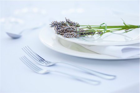 fine dining restaurant - Table setting with forks, plates and lavender flowers Stock Photo - Premium Royalty-Free, Code: 6115-07282842