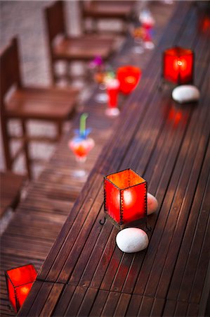 Tea lights and stones as table decoration, Dubrovnik, Croatia Stock Photo - Premium Royalty-Free, Code: 6115-07282844