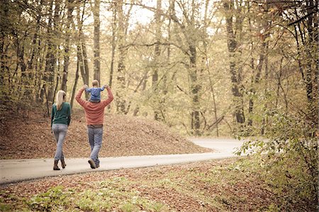 fall mother leaves - Parents with son walking across road, Osijek, Croatia Stock Photo - Premium Royalty-Free, Code: 6115-07539779