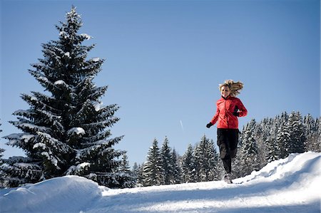 Woman jogging in winter landscape, Garmisch, Bavaria, Germany Stock Photo - Premium Royalty-Free, Code: 6115-07539793