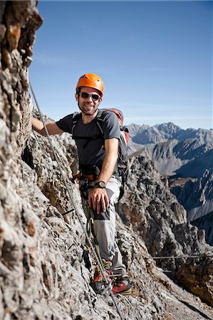 risk mountain - Male alpinist rock climbing, Innsbruck route, Tyrol, Austria Stock Photo - Premium Royalty-Free, Code: 6115-07539818