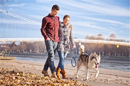 Couple Walking Dog Outdoors, Croatia Stock Photo - Premium Royalty-Free, Code: 6115-08066355