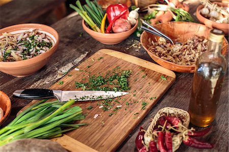 simsearch:6118-07808971,k - Fresh parsley on cutting board among variety of ingredients Stock Photo - Premium Royalty-Free, Code: 6115-08066616