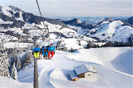 ski lift - Ski holiday, People sitting in ski lift, Sudelfeld, Bavaria, Germany Stock Photo - Premium Royalty-Free, Code: 6115-08149322