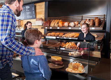 display cabinet - Father and son buying organic cake in a bakery Stock Photo - Premium Royalty-Free, Code: 6115-08100512