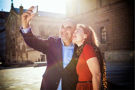 Senior couple taking a self portrait, Munich, Bavaria, Germany Stock Photo - Premium Royalty-Free, Code: 6115-08100689