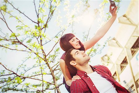 simsearch:632-07674444,k - Young couple taking self-portrait outdoors, Osijek, Croatia Stock Photo - Premium Royalty-Free, Code: 6115-08100713