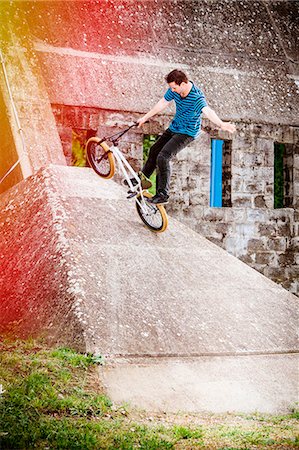 ramp (sloping incline) - BMX biker performing a stunt on a bridge Stock Photo - Premium Royalty-Free, Code: 6115-08100898