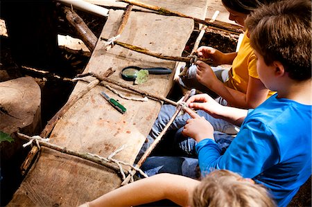 simsearch:6115-06778553,k - Children crafting in a forest camp, Munich, Bavaria, Germany Stock Photo - Premium Royalty-Free, Code: 6115-08100811