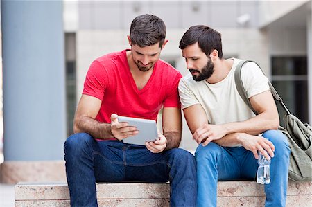 student (male) - Two male university students using digital tablet on campus Stock Photo - Premium Royalty-Free, Code: 6115-08101122