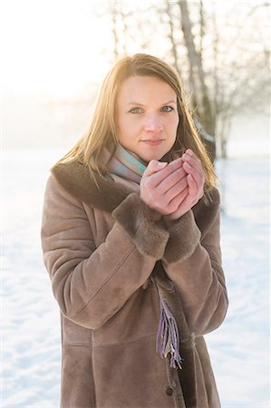 Young woman in warm clothing in winter Stock Photo - Premium Royalty-Free, Code: 6115-08105178