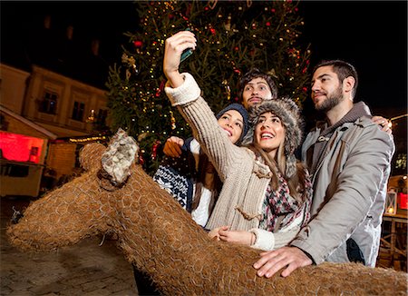 Friends taking selfie at Christmas Market Stock Photo - Premium Royalty-Free, Code: 6115-08105128