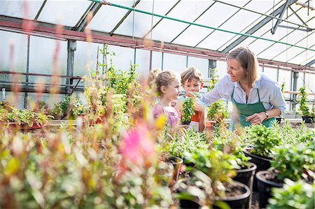 simsearch:6113-07589172,k - Female gardener and children in greenhouse Stock Photo - Premium Royalty-Free, Code: 6115-08239160