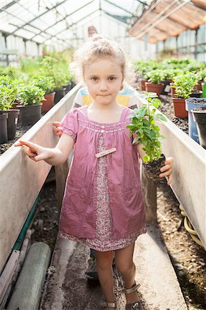 family gardening - Female gardener and children in greenhouse Stock Photo - Premium Royalty-Free, Code: 6115-08239162