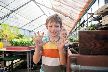 simsearch:6115-07539732,k - Boy in greenhouse showing his dirty hands Stock Photo - Premium Royalty-Free, Code: 6115-08239167