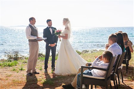 simsearch:6113-07992186,k - Bride and groom at wedding ceremony on beach Stock Photo - Premium Royalty-Free, Code: 6115-08239447