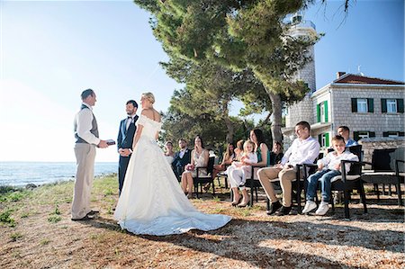 simsearch:6113-07992186,k - Bride and groom at  wedding ceremony on beach Stock Photo - Premium Royalty-Free, Code: 6115-08239449
