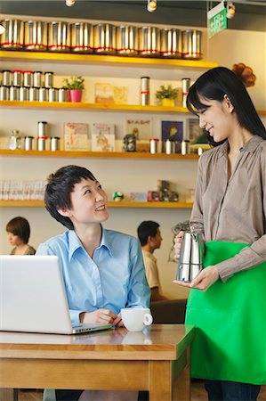 Barista serving coffee to customer, Beijing Stock Photo - Premium Royalty-Free, Code: 6116-06938602