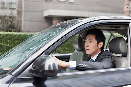 driving in asia - Businessman Driving Car Foto de stock - Sin royalties Premium, Código: 6116-06938893