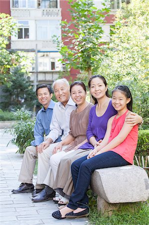 simsearch:6116-06939008,k - Three Generation Family Sitting in their Apartment Courtyard Stock Photo - Premium Royalty-Free, Code: 6116-06938812