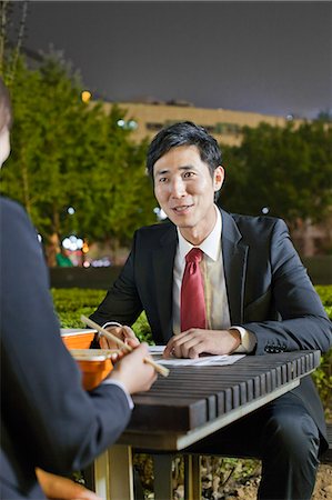simsearch:6116-07084811,k - Business People Working While Having Dinner Stock Photo - Premium Royalty-Free, Code: 6116-06938903