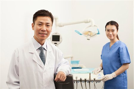 dentist and smile - Portrait Of Dentist In Clinic Stock Photo - Premium Royalty-Free, Code: 6116-06938936